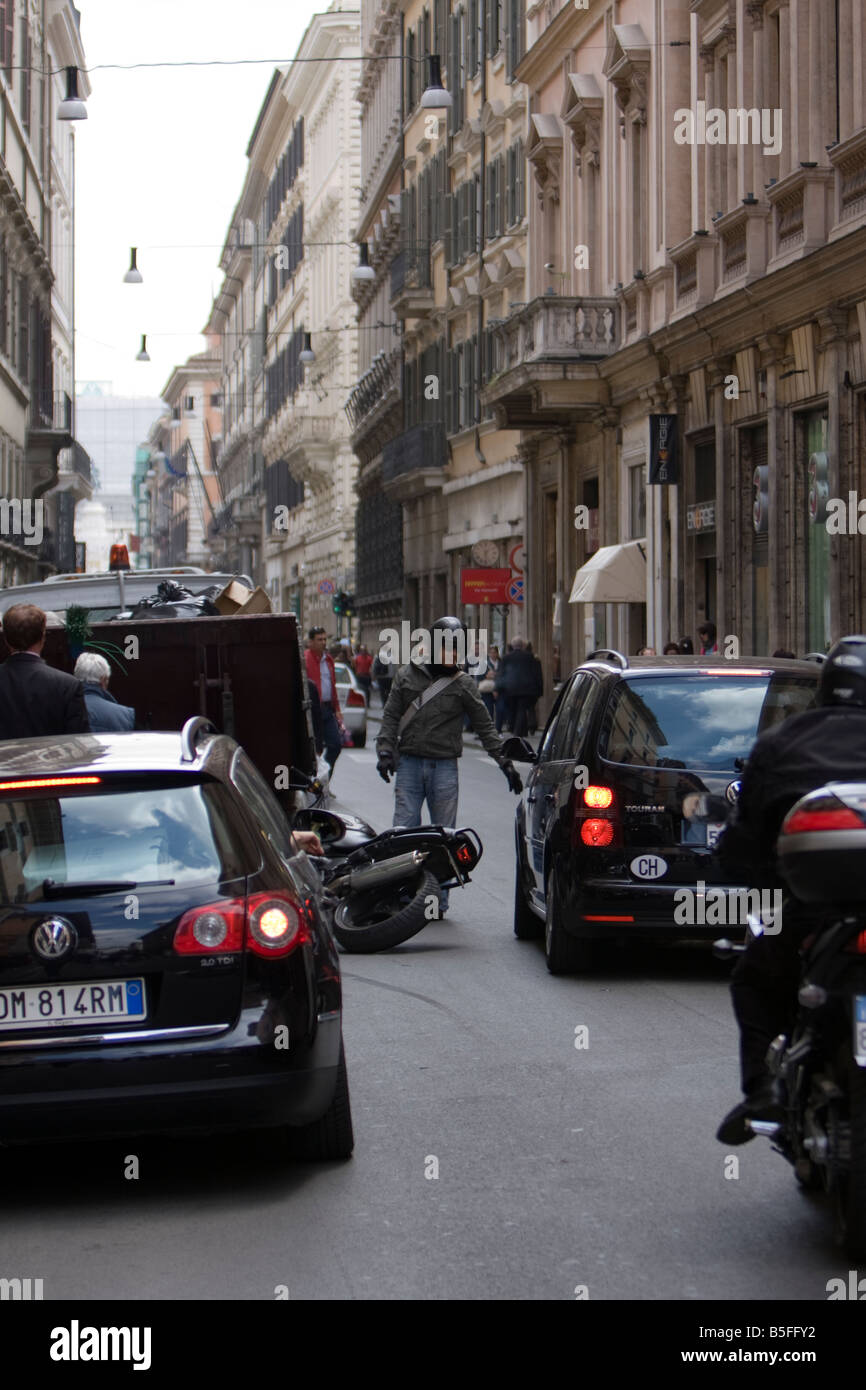 A car and bike accident, crash,  in Typical Street in Trastevere District Rome Italy Stock Photo