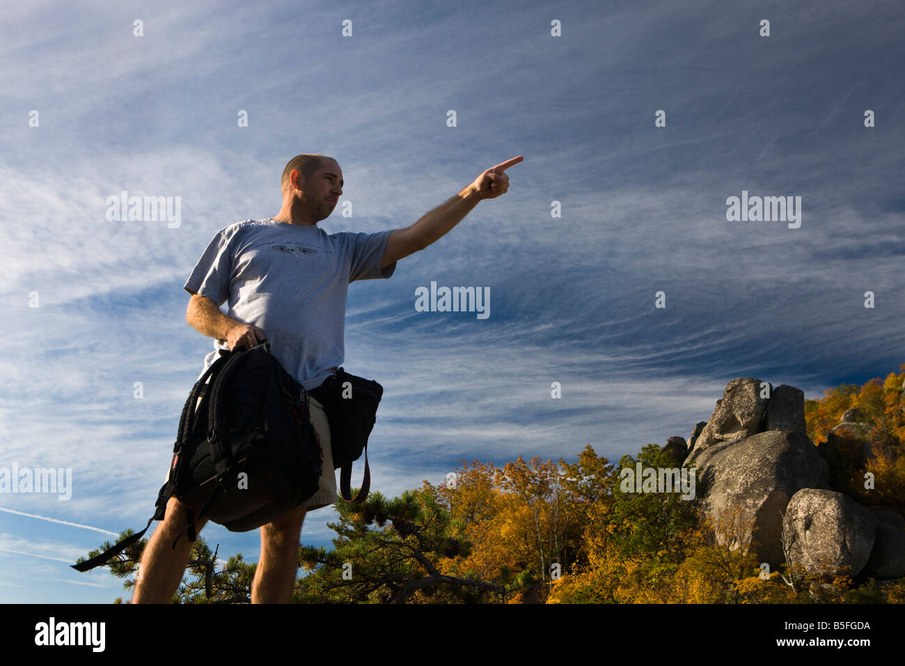 Male hiker pointing to the summit of Old Rag Mountain, Shenandoah National Park, Virginia. Stock Photo