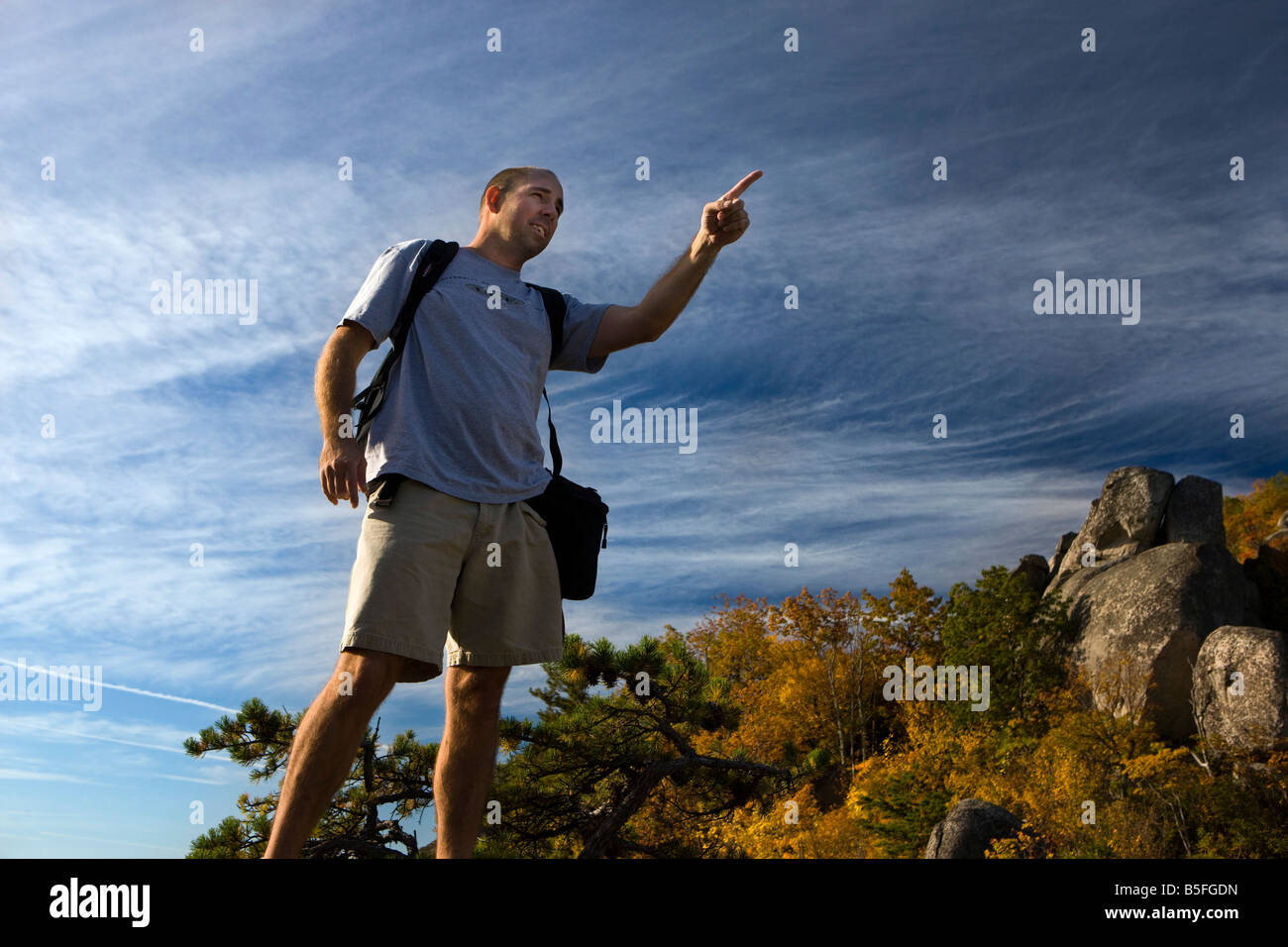 Male hiker pointing to the summit of Old Rag Mountain, Shenandoah National Park, Virginia. Stock Photo