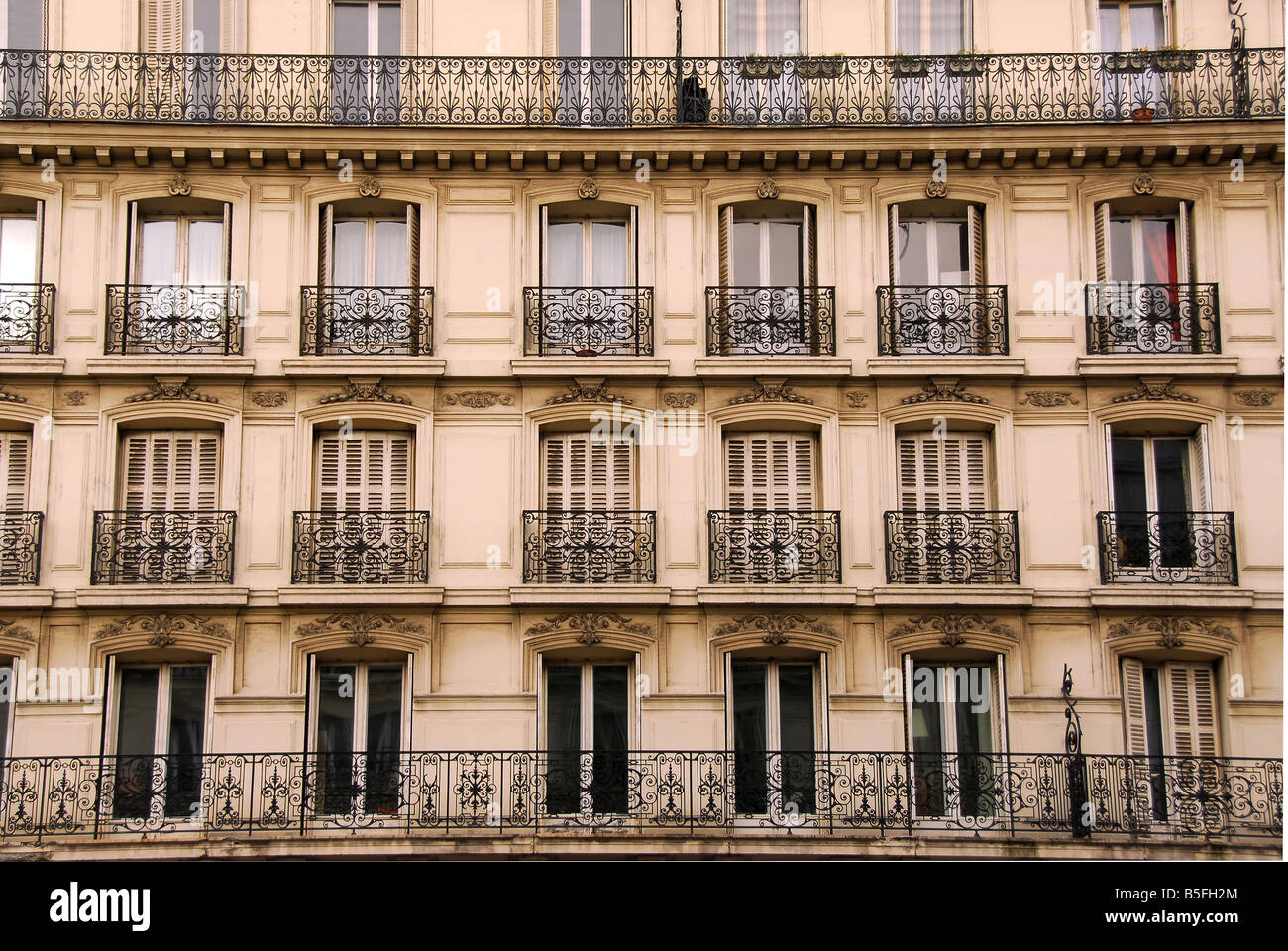 Windows and balconies of old apartment buildings in Paris France Stock Photo