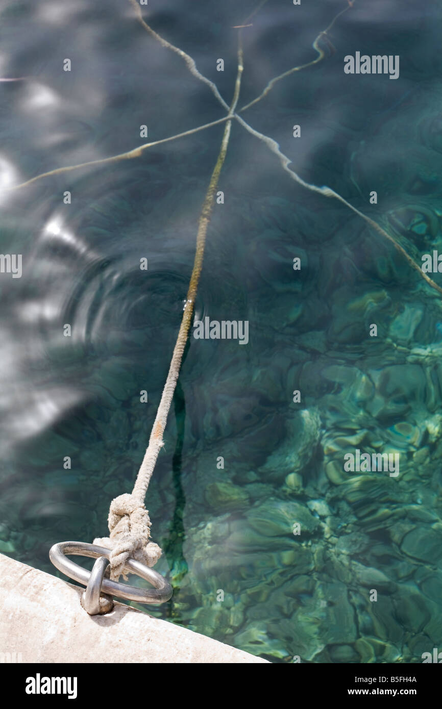 Boat ropes crossing over under water in Hvar harbour Hvar Island Croatia Stock Photo