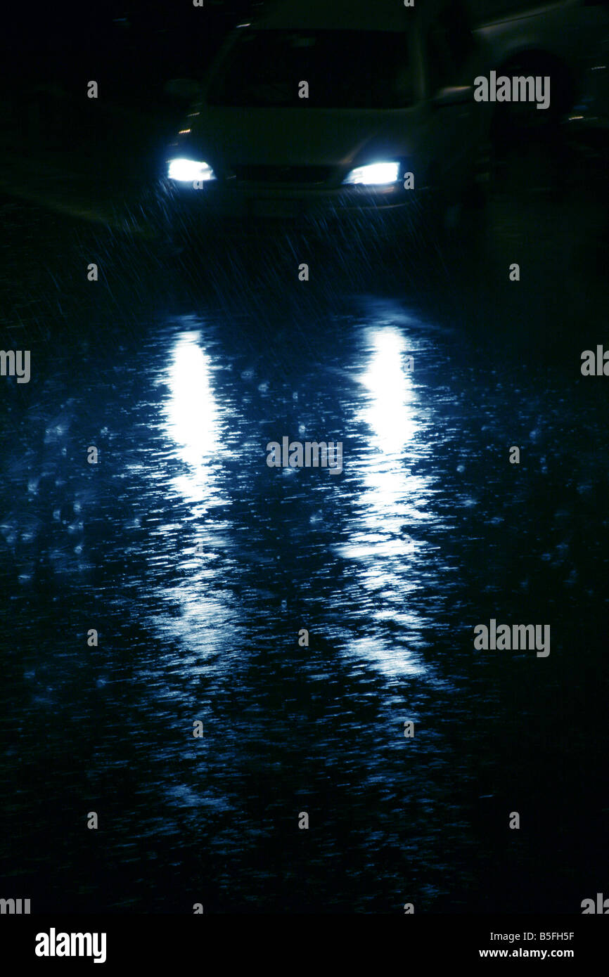fast car driving in heavy rain at night in town Stock Photo Alamy