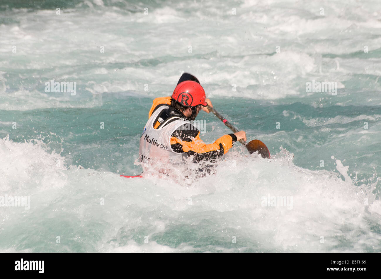 Competitor in whitewater kayaking competition Stock Photo Alamy