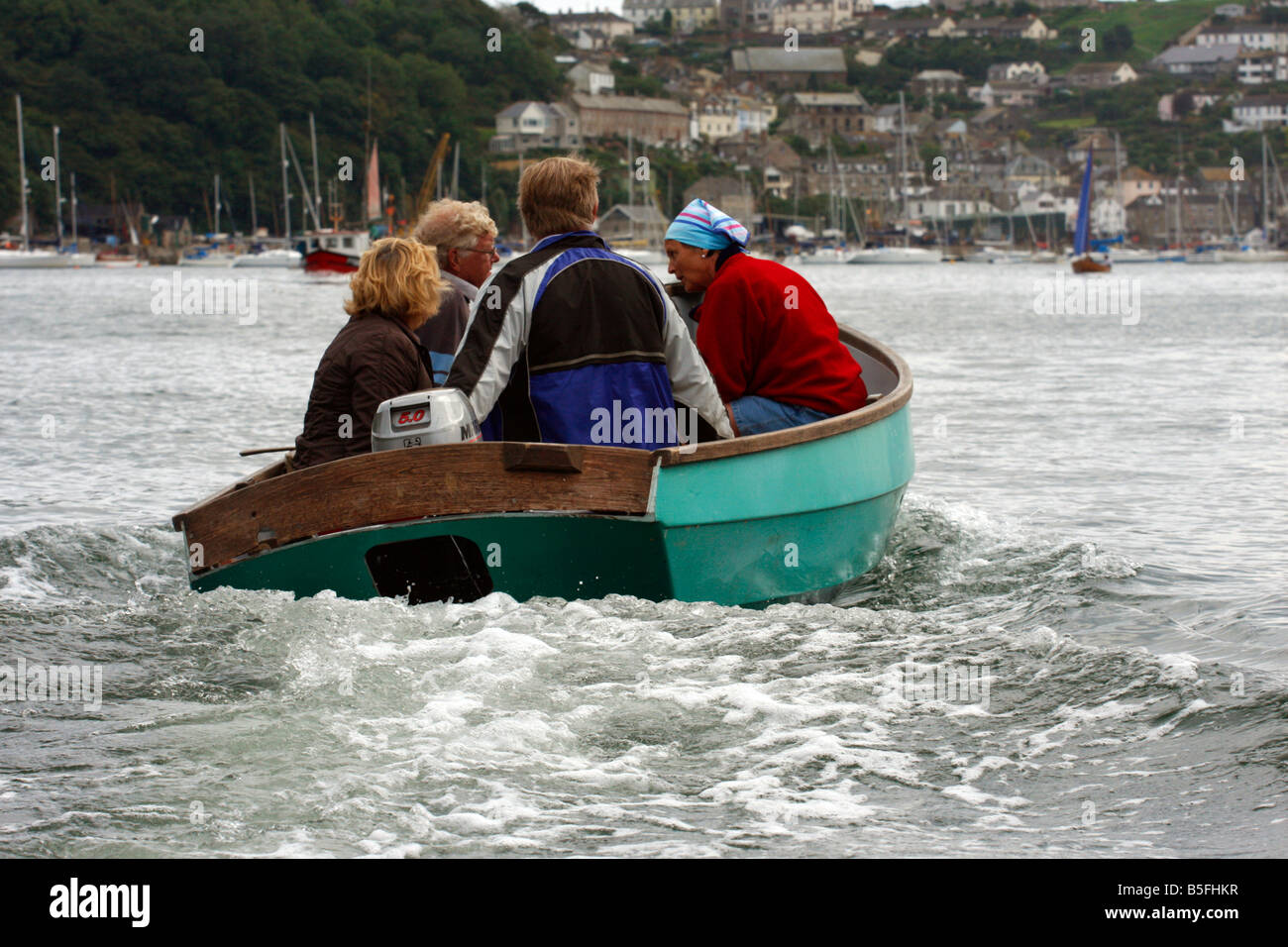 Launch Rib Cornwall Four people in a small launch in Fowey harbour Cornwall Stock Photo - Alamy