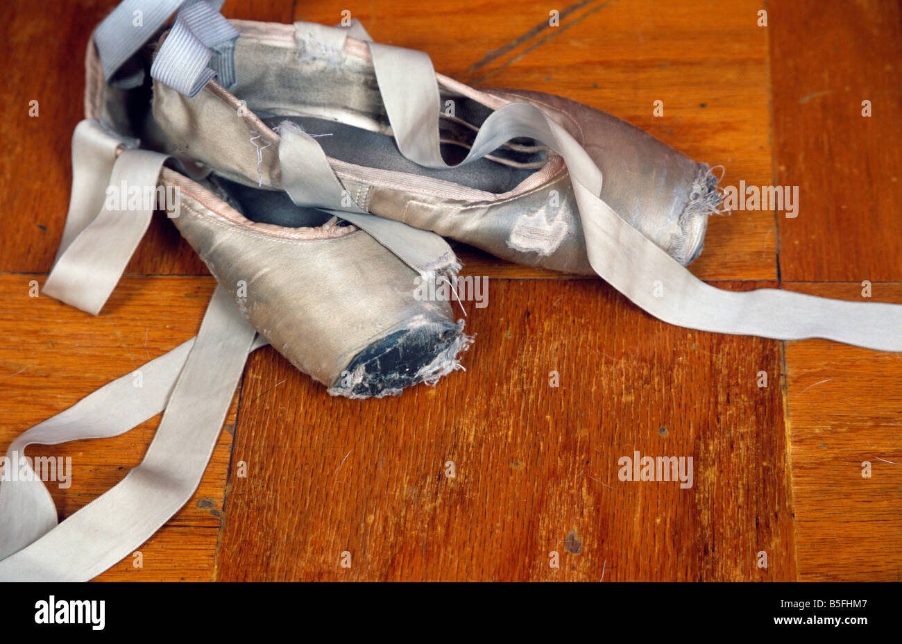 Ballet Point Shoes On Dance Studio Floor Stock Photo