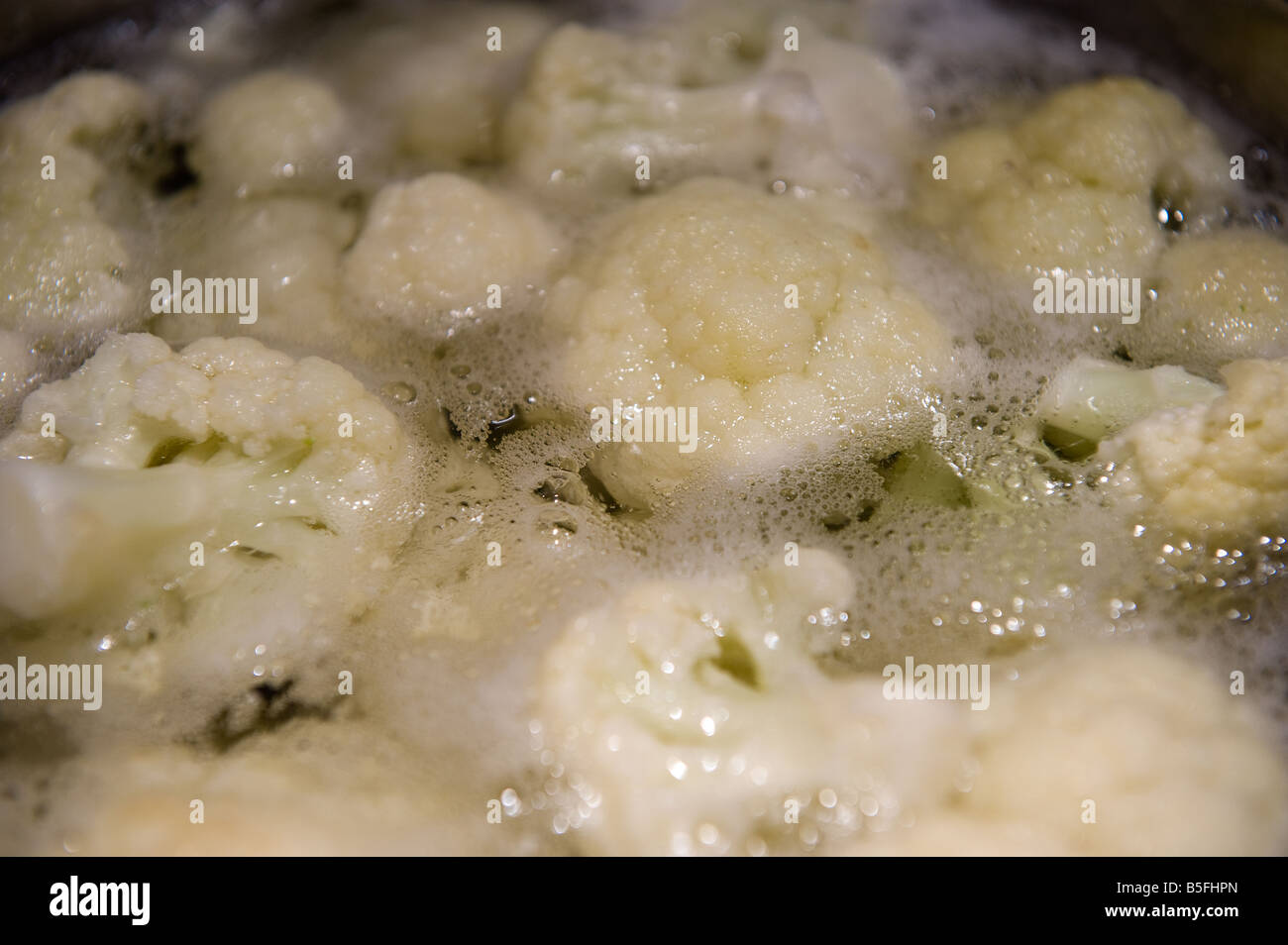 Cauliflower Florets boiling in a pot Stock Photo
