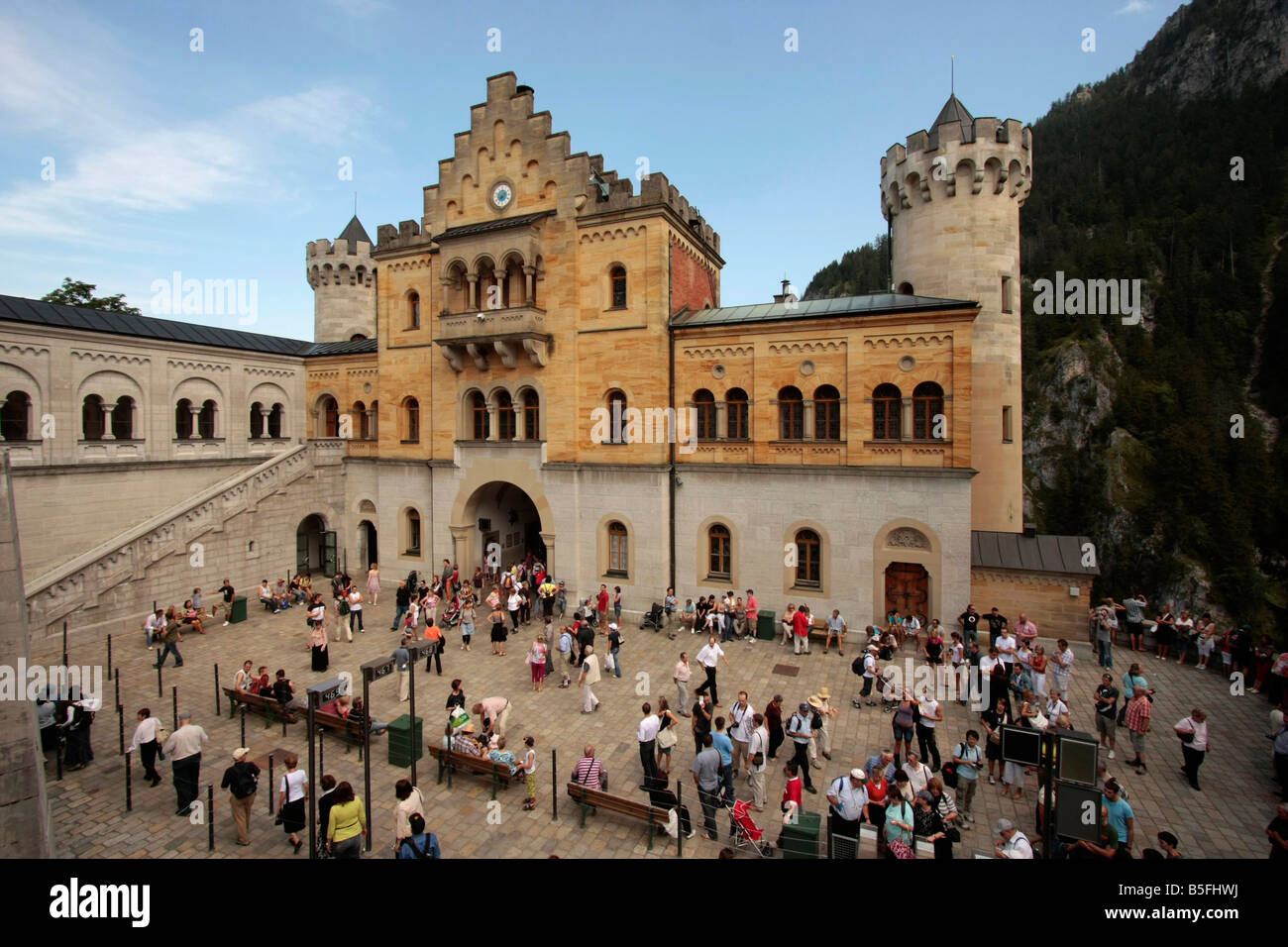 visitors at the courtyard of Neuschwanstein Castle in Schwangau near Fuessen Allgaeu Bavaria Germany Stock Photo