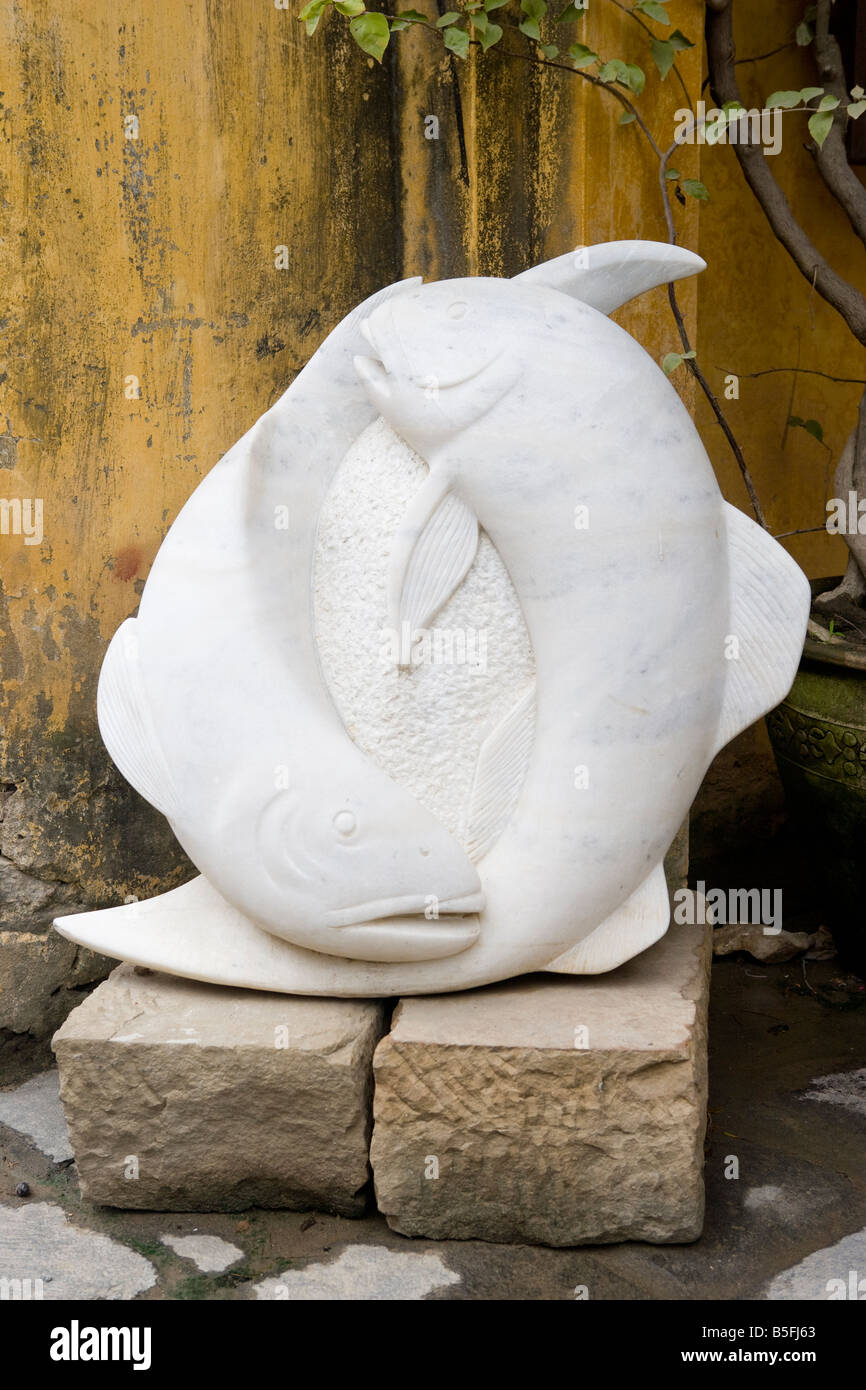 Sculpture outside an art gallery, galleries are now found all over Hoi An,  Vietnam Stock Photo - Alamy