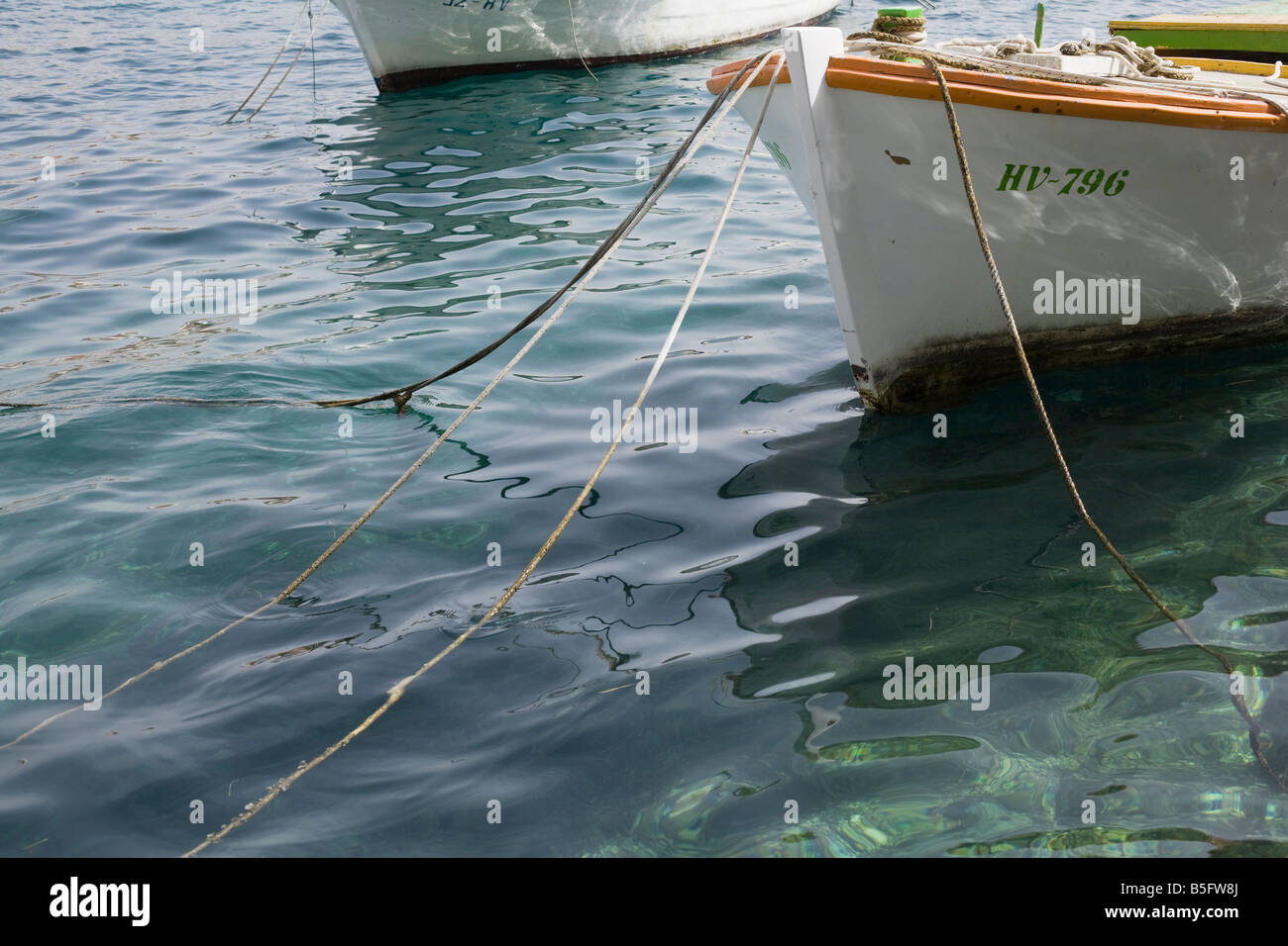 Boat with ropes in Hvar harbour Hvar Island Croatia Stock Photo