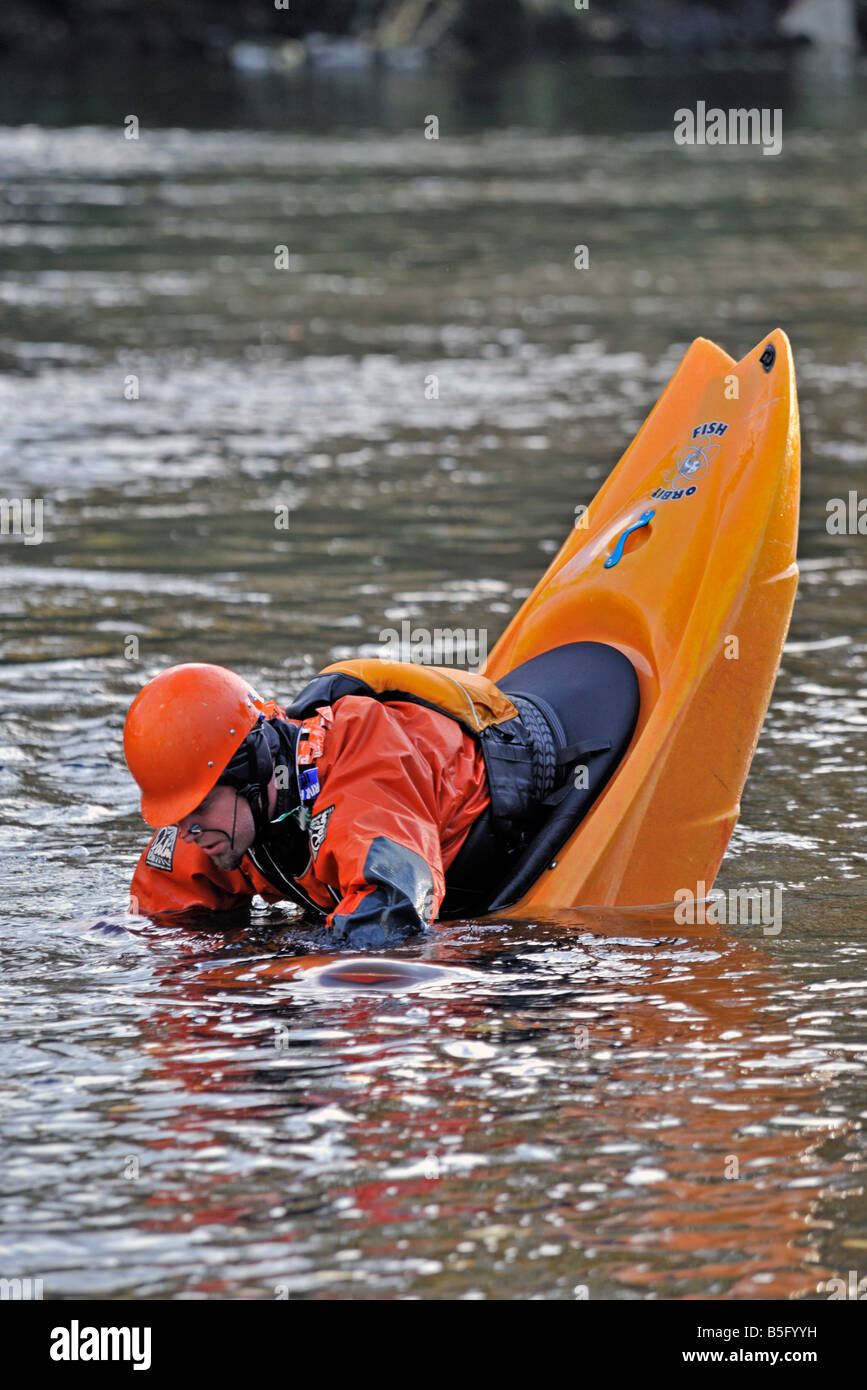 Kayaker practising capsizing drill in Necky Orbit Fish kayak. River