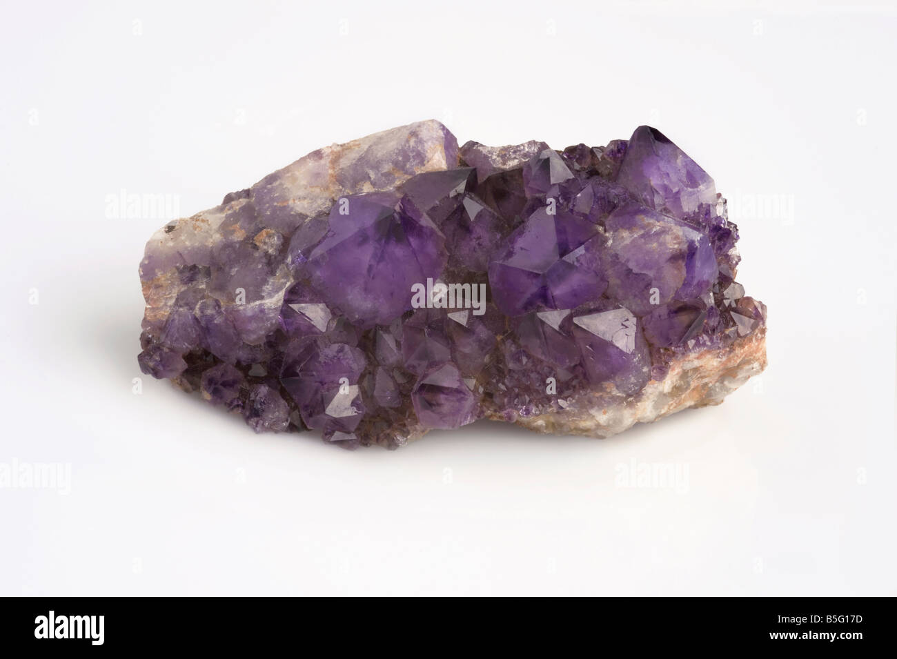 Amethyst crystal cluster on white background Stock Photo