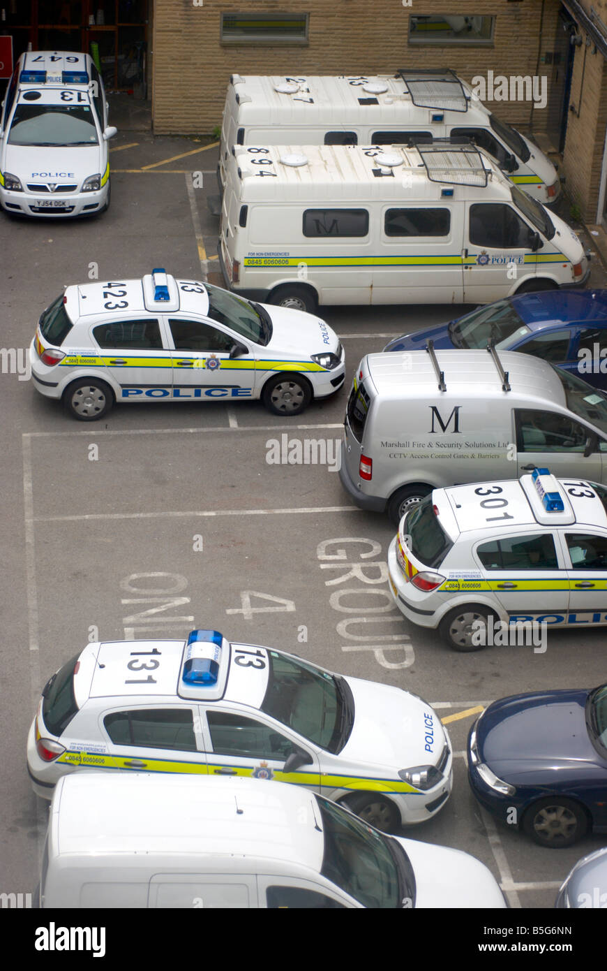 Police cars in a West Yorkshire police station car park Stock Photo