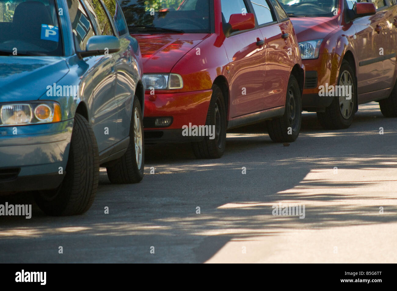 Cars parked by the road. Stock Photo