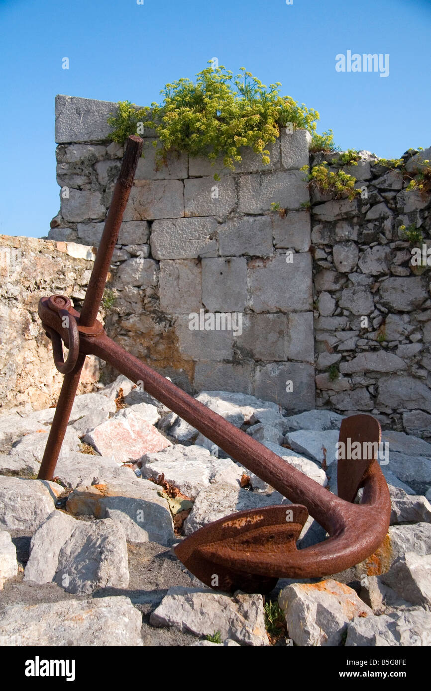 Large boat anchor in the harbor at Llanes Asturias Spain Stock Photo