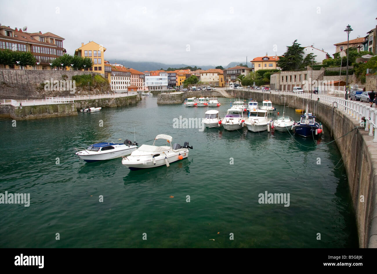 High tide in the harbor at Llanes Asturias Spain Stock Photo