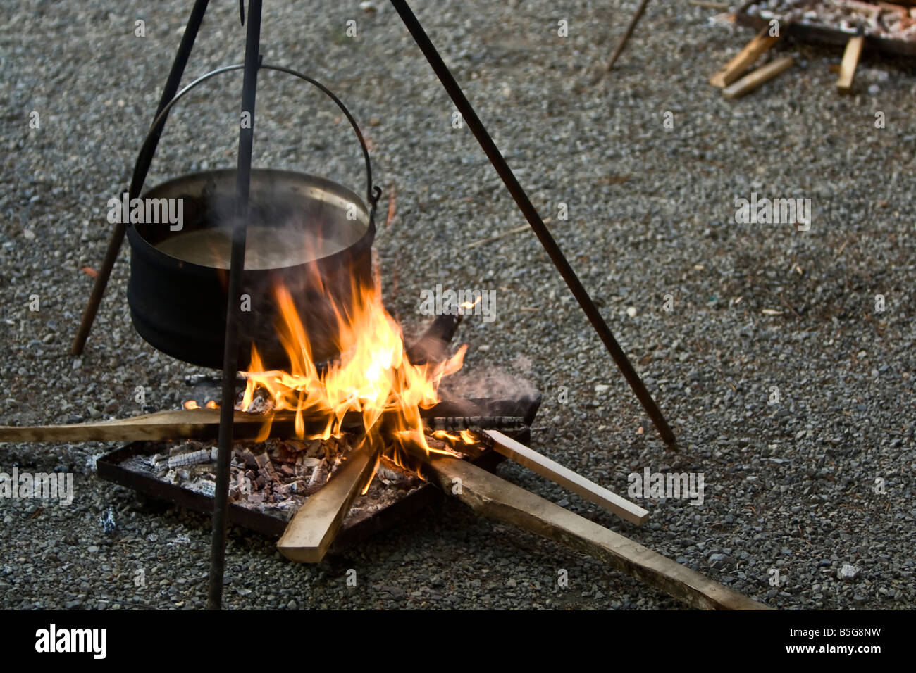 cooking in a pot on fire Stock Photo Alamy