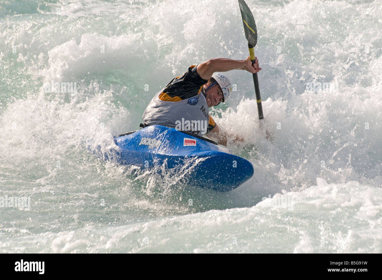 Competitor in whitewater kayaking competition Stock Photo Alamy