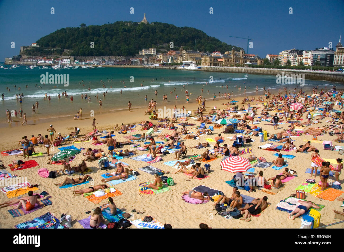Beach scene at La Concha Bay in the city of Donostia San Sebastian Guipuzcoa Basque Country Northern Spain Stock Photo