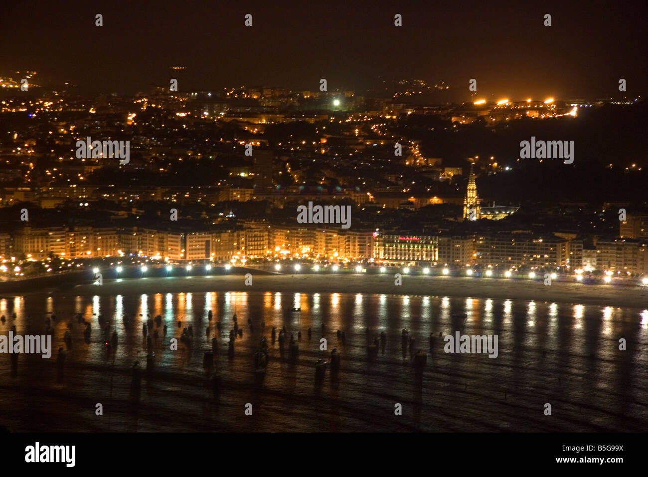 La Concha Bay and the city of Donostia San Sebastian at night Guipuzcoa Basque Country Northern Spain Stock Photo