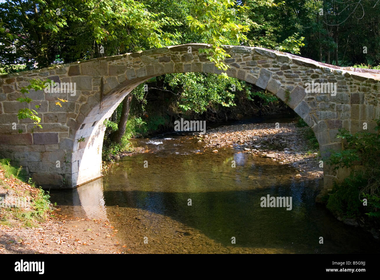 Stone footbridge near the village of Sare Pyrenees Atlantique French Basque Country Southwest France Stock Photo