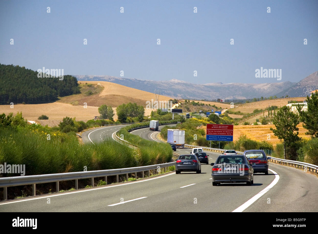 Automobiles travel on the Autopista near Pamplona Navarre northern Spain Stock Photo