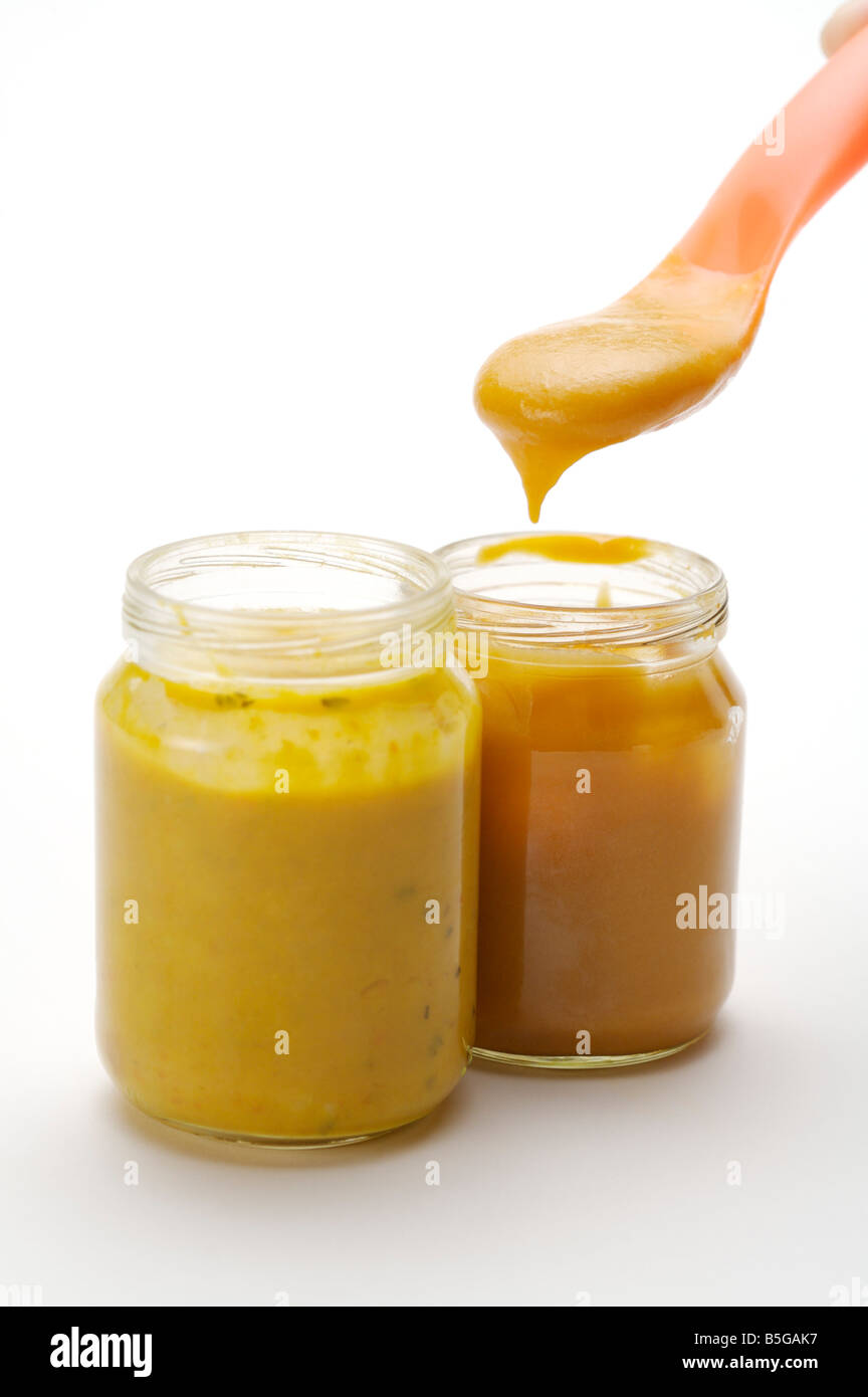 Opened cans of baby food Stock Photo Alamy
