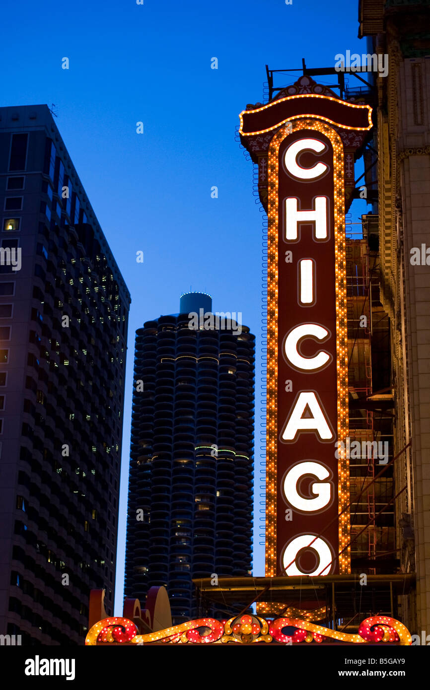 The famous Chicago Theatre Marquee glows against the downtown skyline