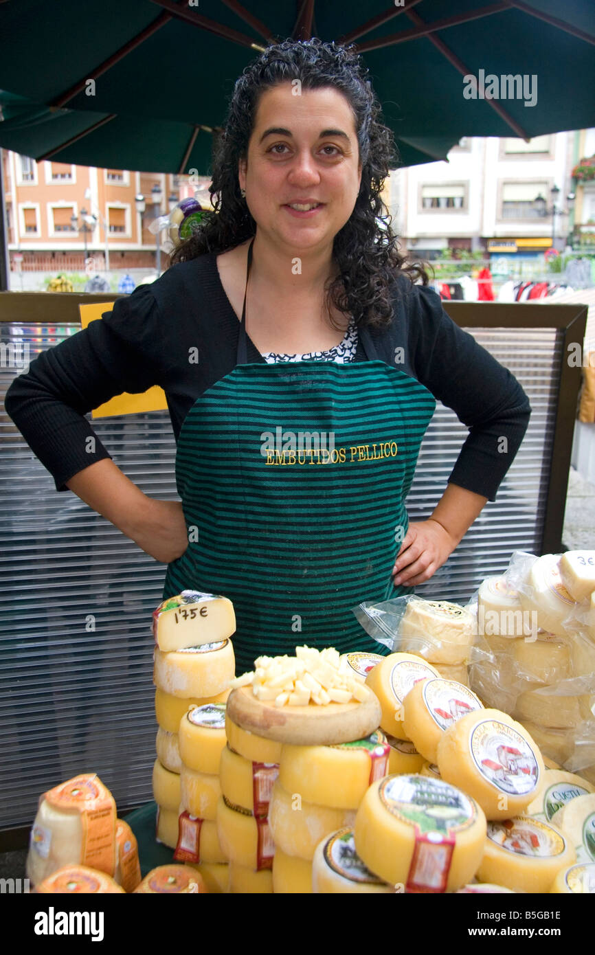 Spanish woman selling cheese at an outdoor market in the town of Cangas de Onis Asturias northern Spain Stock Photo