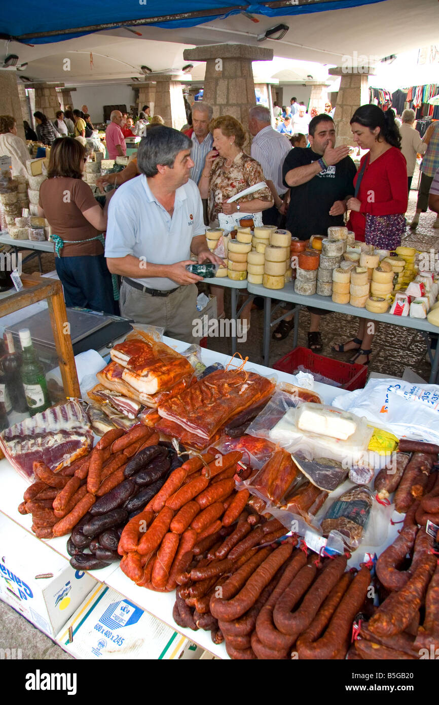 Vendors selling cheese and meats at an outdoor market in the town of Cangas de Onis Asturias northern Spain Stock Photo