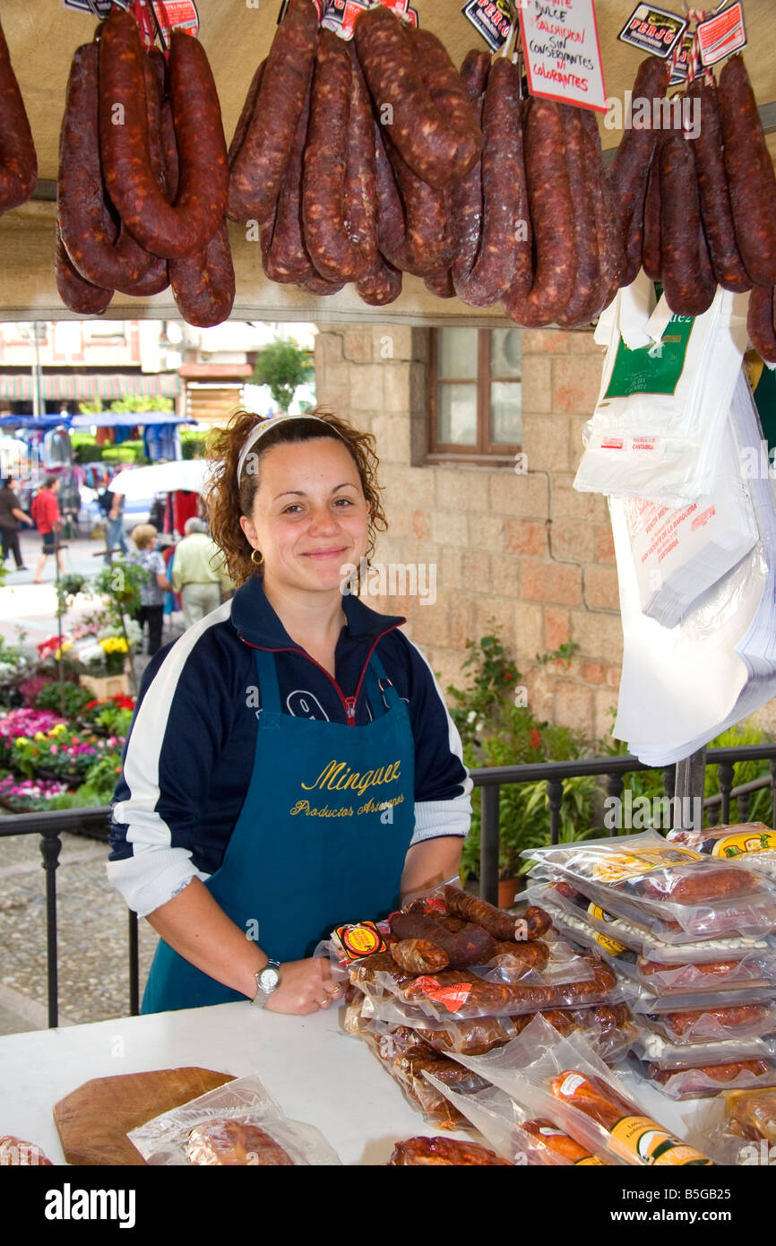 Spanish woman selling cured meats at an outdoor market in the town of Cangas de Onis Asturias northern Spain Stock Photo