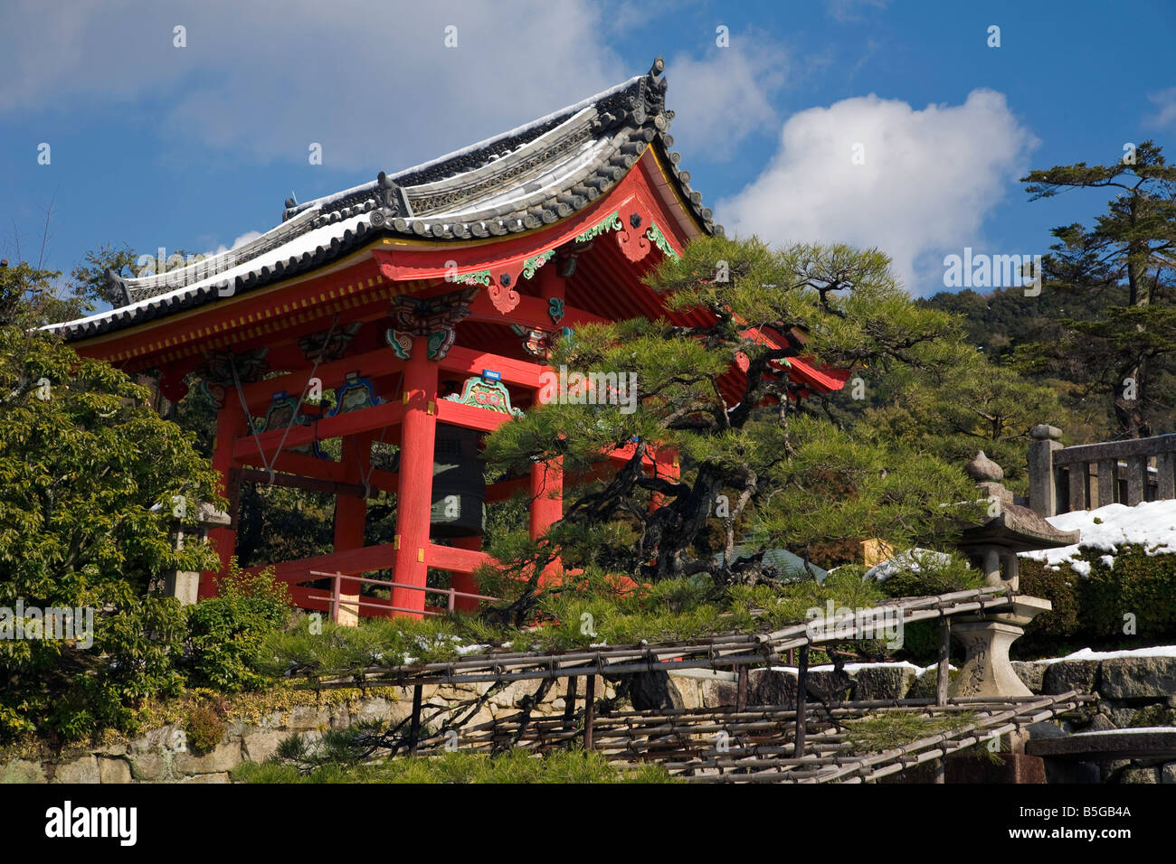 Kyoto City Japan Kiyomizu Temple stone lanterns with temple bell tower in the background Stock Photo