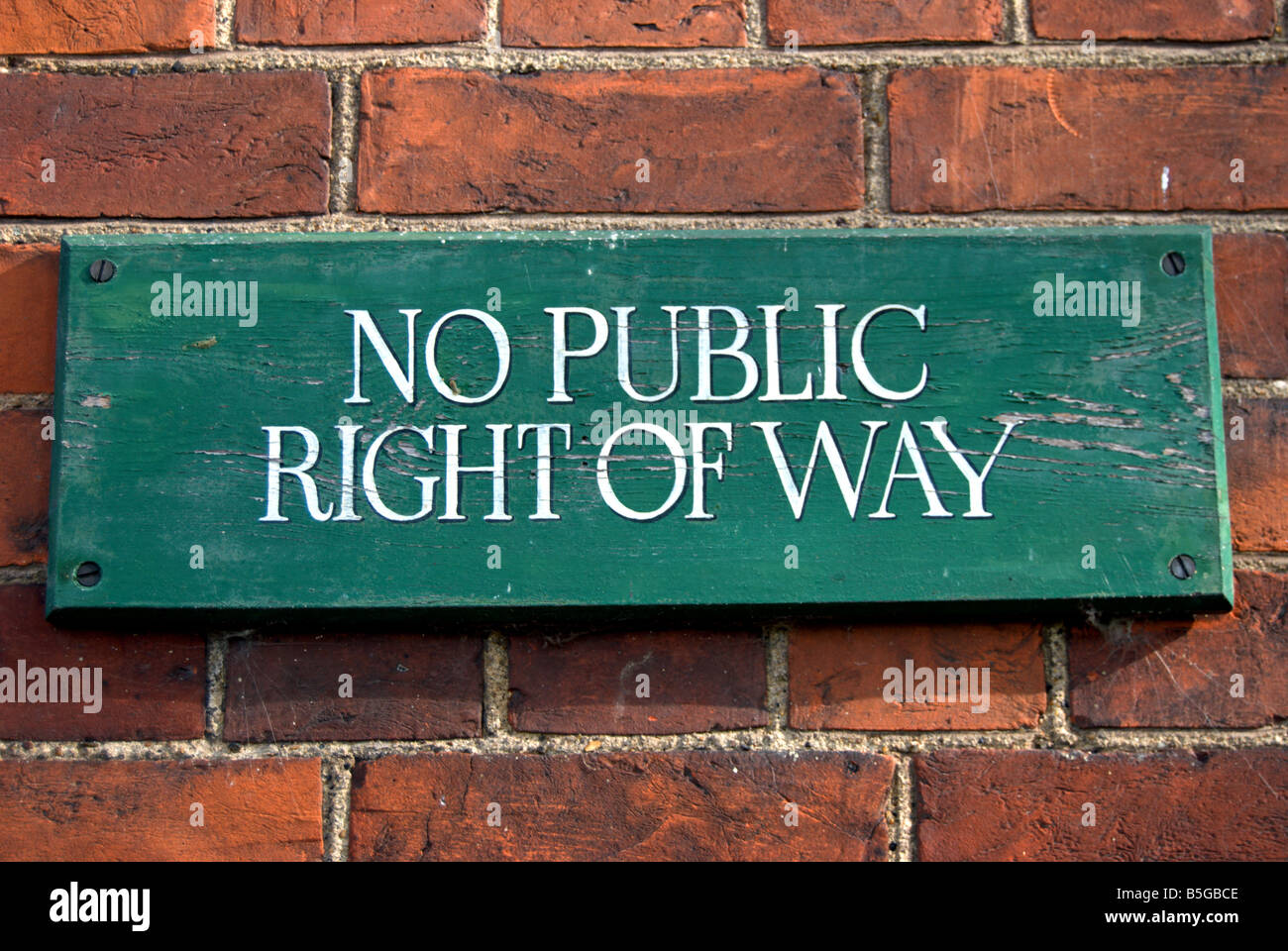 british no public right of way sign fixed to a brick wall in bedford park, chiswick, london, england Stock Photo