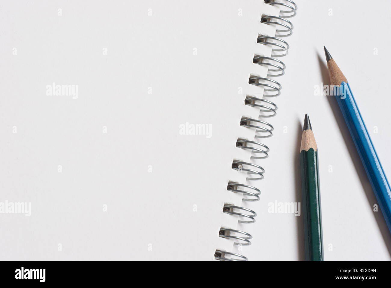 Spiral sketch pad and color pencils template image. Good copy space. Back  to school, homework, hand drawing artist concept Stock Photo - Alamy