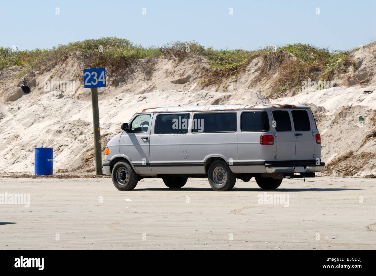 Old van driving on the beach, southern Texas, USA Stock Photo