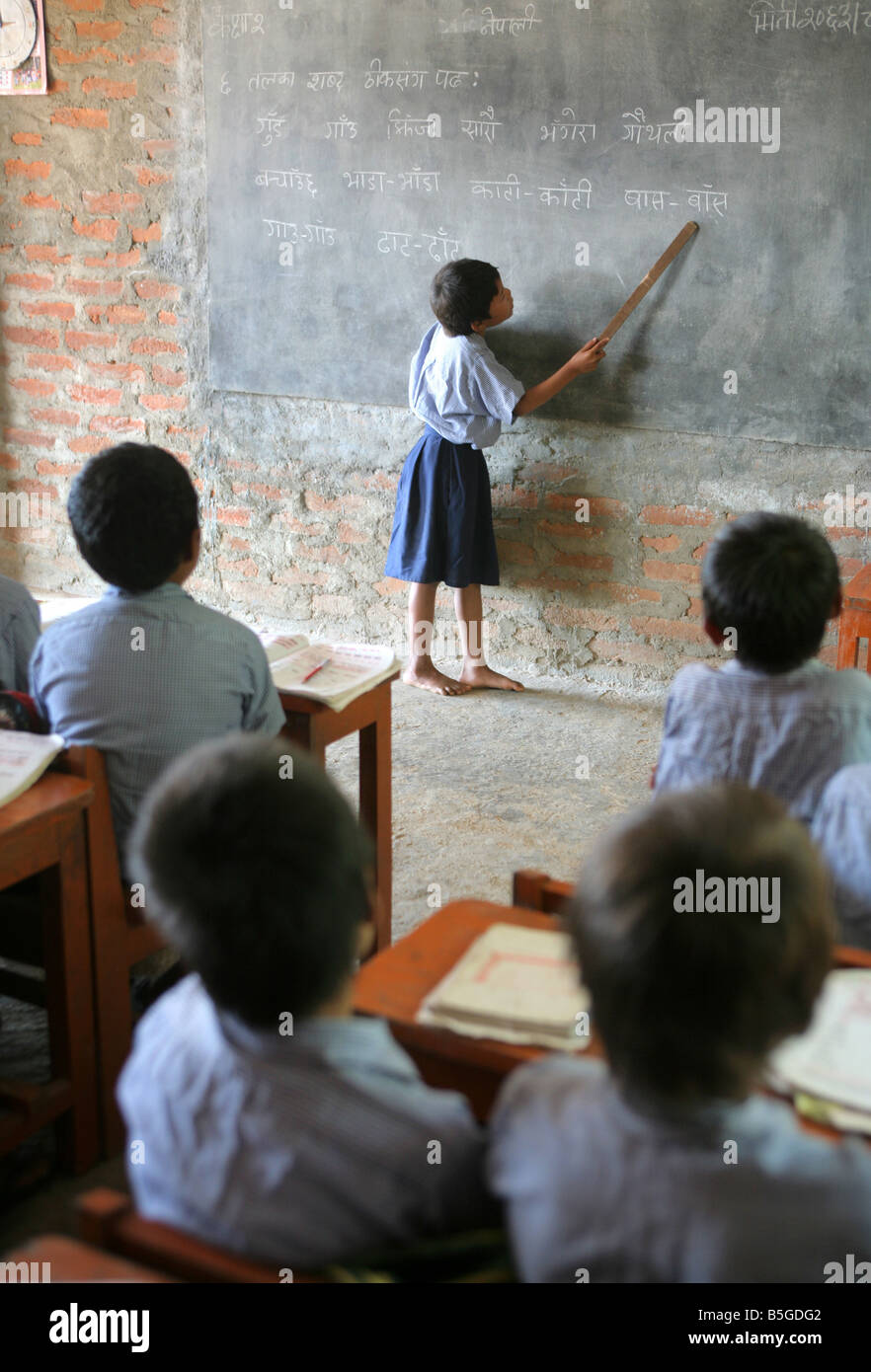 Nepal, girl on a blackboard, lesson in a village school in Jayamangala Stock Photo