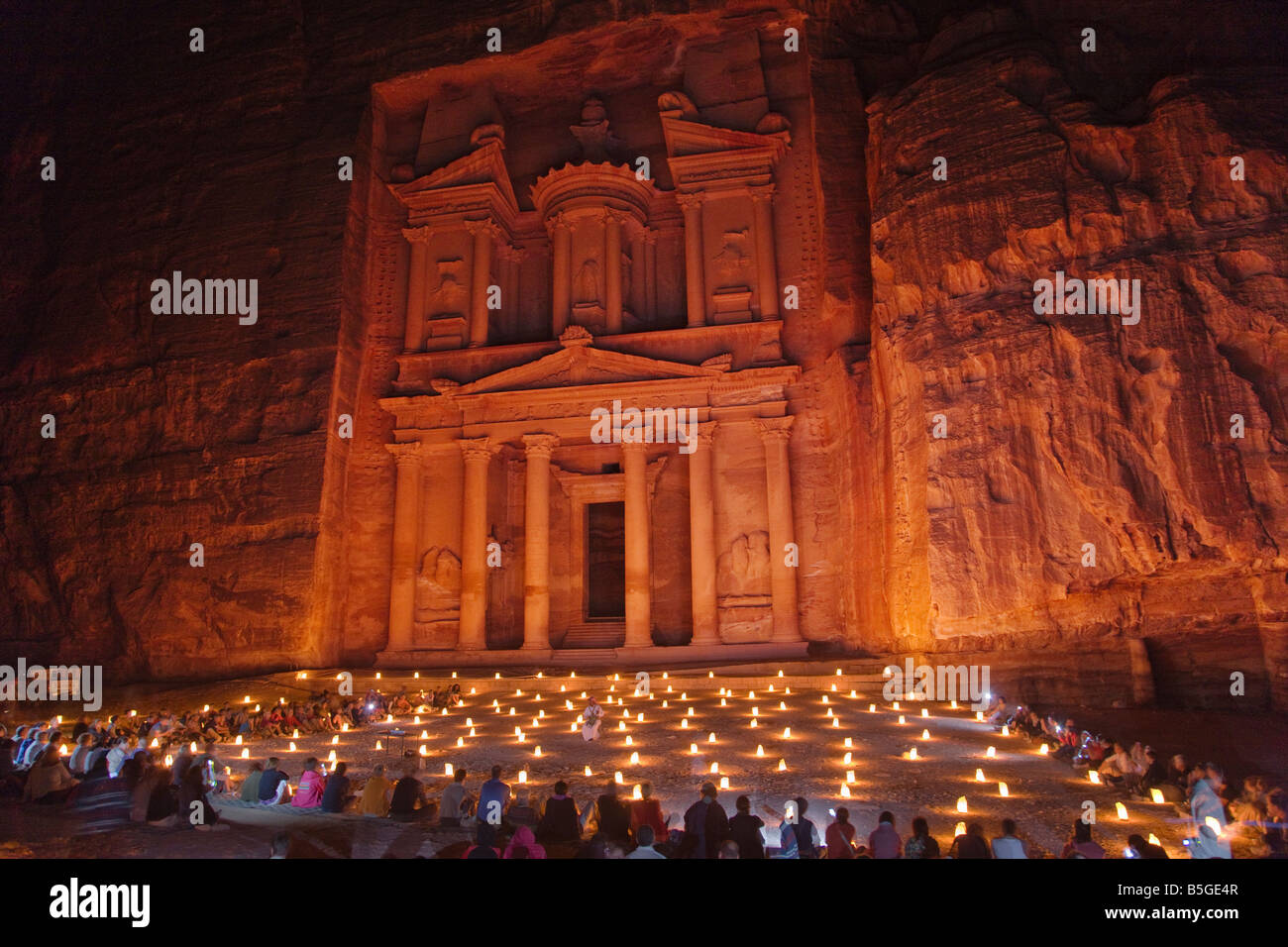 Night view of candles burning at Facade of Treasury Al Khazneh Petra Jordan Stock Photo