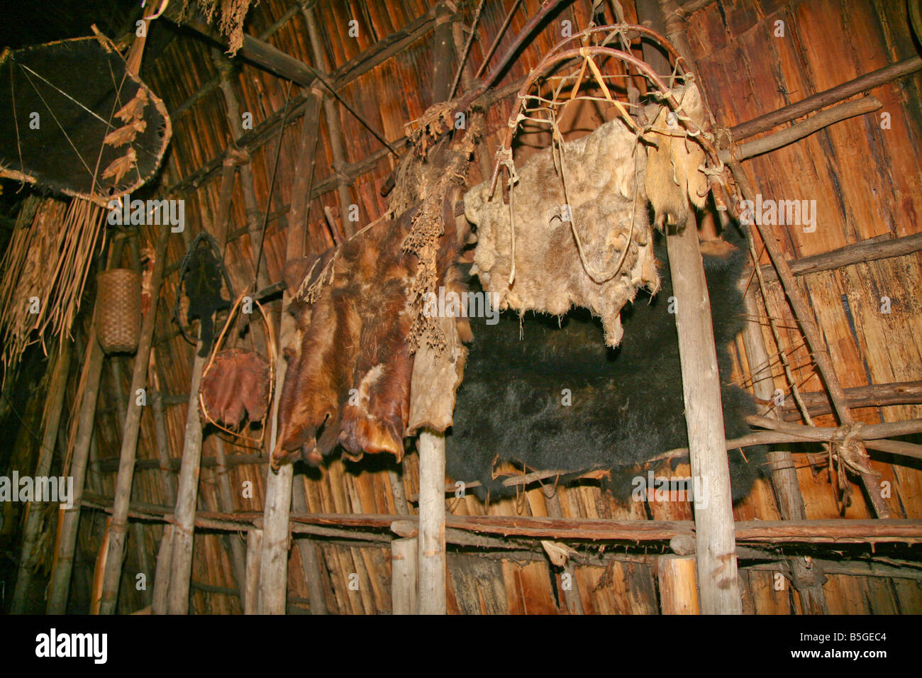 Furs are hang-up to dry in long-house at Aboriginal Village of the Huron-Jesuits Indians near Midland,Ontario,Canada Stock Photo