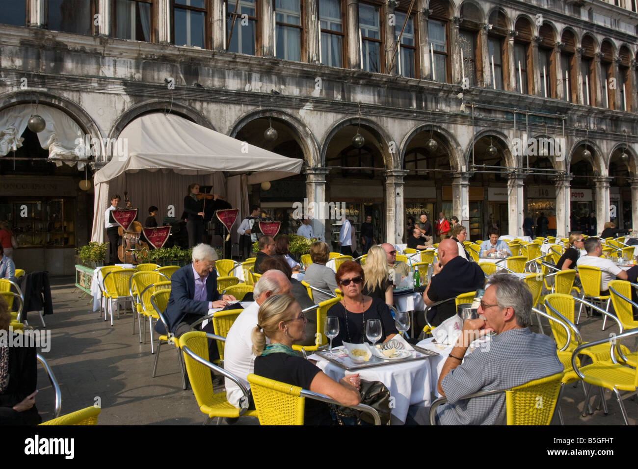 EU Venice Italy. Dining al fresco in St Marks Square Stock Photo