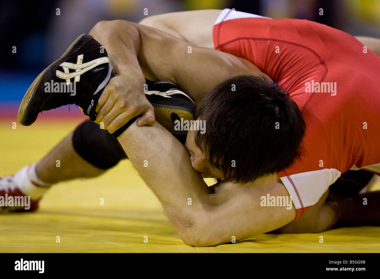 Kenichi Yumoto JPN L competing against Vitaly Koryakin TJK in the 60kg freestyle wrestling 1 8 final event at the 2008 Olympic S Stock Photo