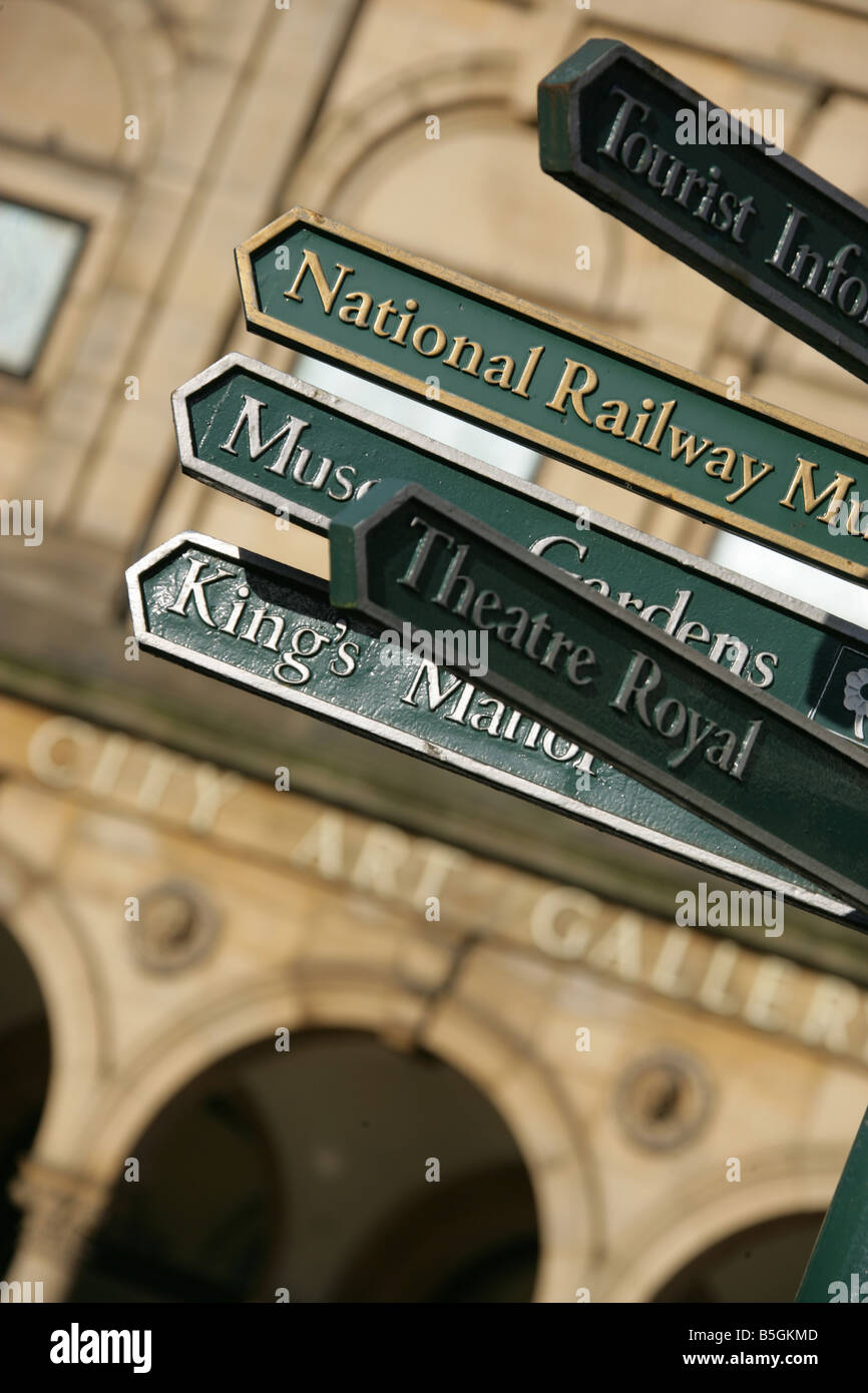 City of York, England. Visitor direction signs in Exhibition Square, with the Edward Taylor designed York City Art Gallery. Stock Photo