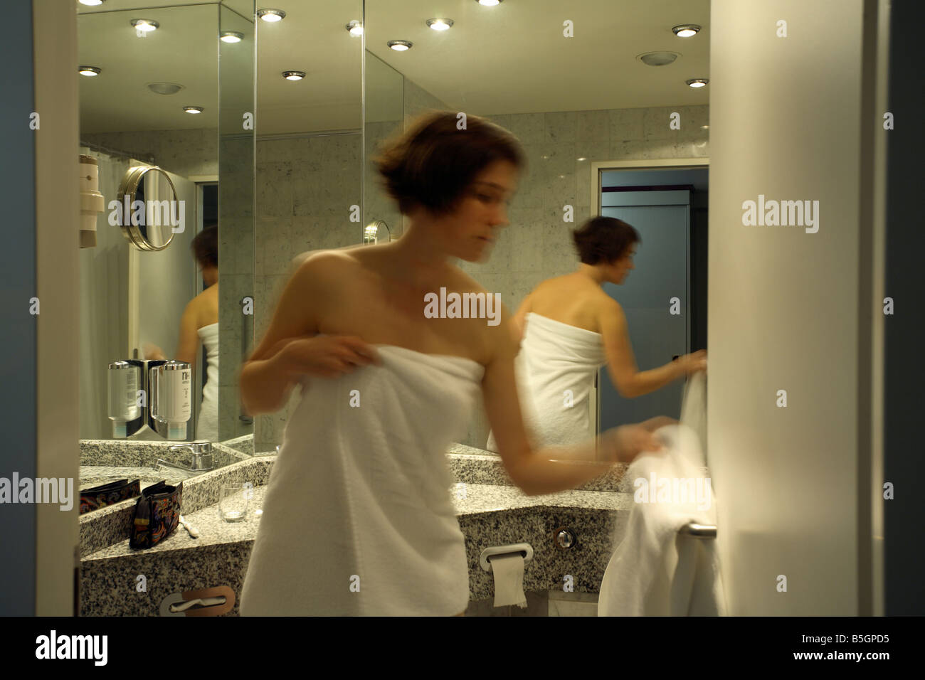 Woman in a bathroom of a hotel in Dessau, Germany Stock Photo - Alamy