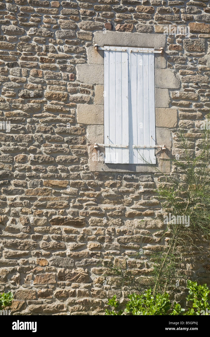 window in stone wall with closed shutters Stock Photo - Alamy