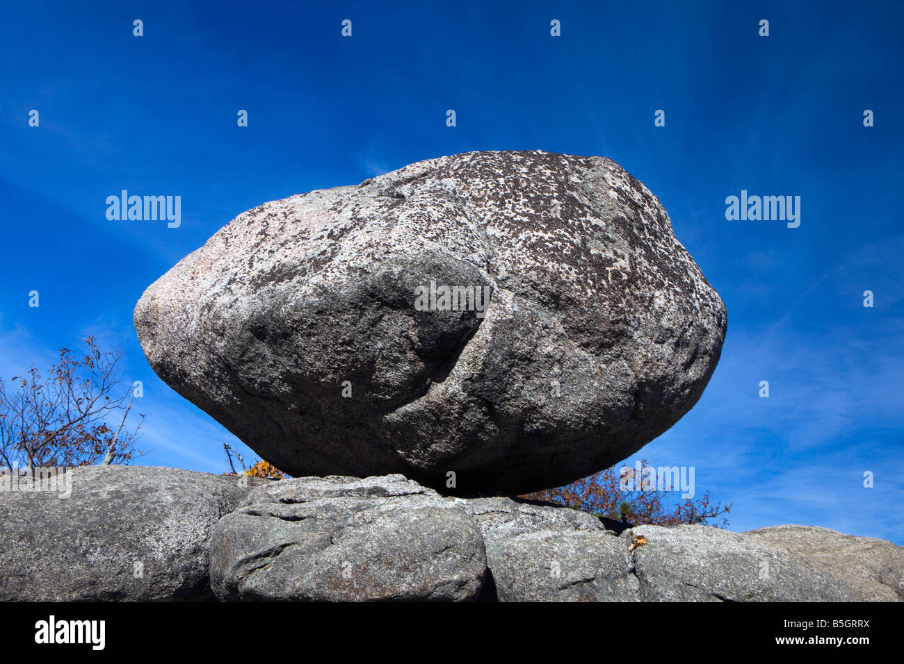 A large granite boulder sits on along the path up Old Rag Mountain, Shenandoah National Park, Virginia. Stock Photo