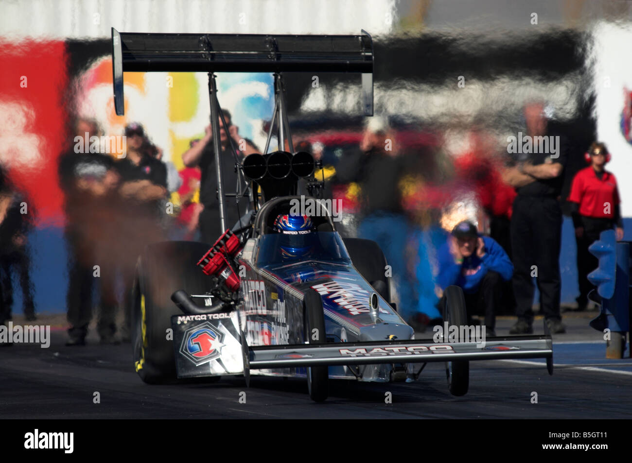 Antron Browns 'Matco Tools' NHRA Top Fuel dragster - taking off from the start line. Stock Photo
