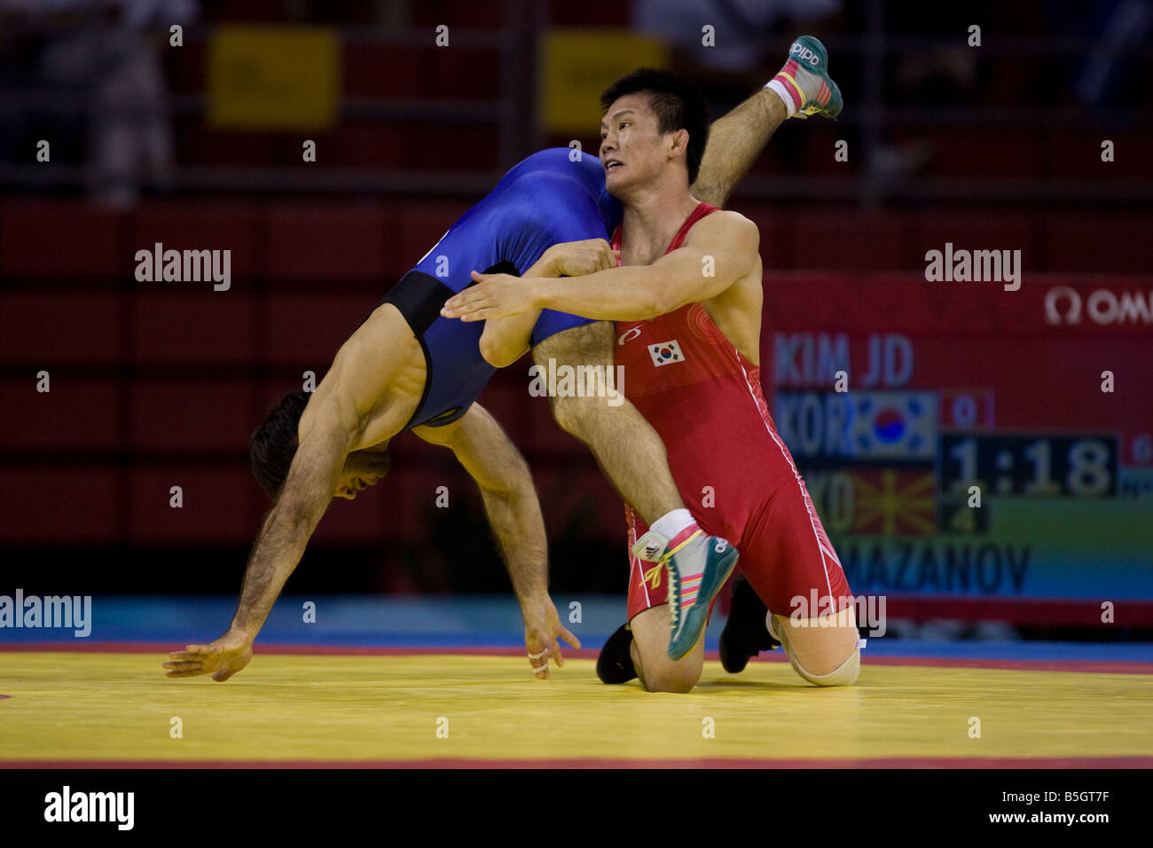 Dae Jong Kim KOR L competing against Muzad Ramazanov MKD in the 60kg freestyle wrestling 1 8 final event at the 2008 Olympic Sum Stock Photo