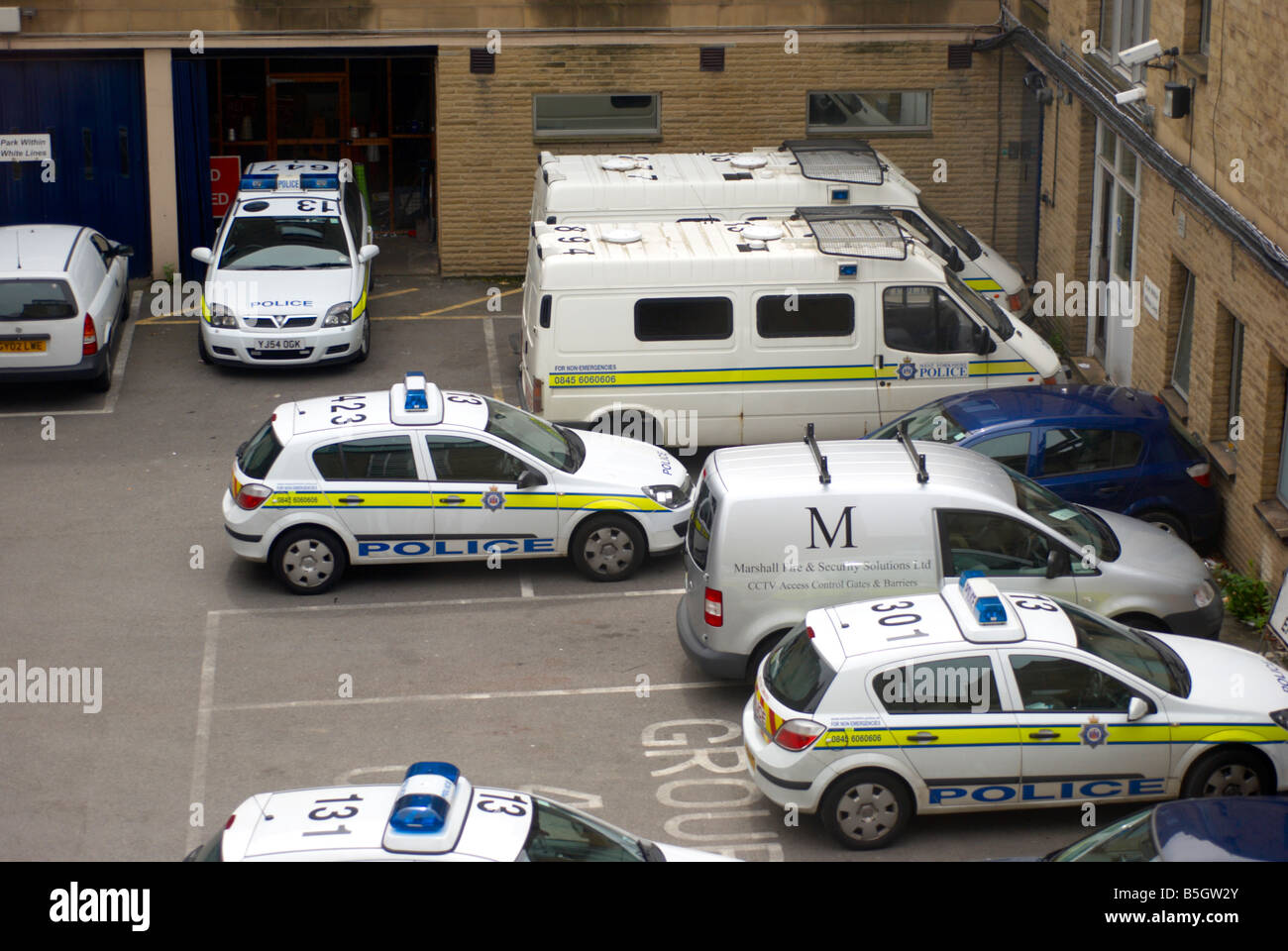 Police cars in a West Yorkshire police station car park Stock Photo