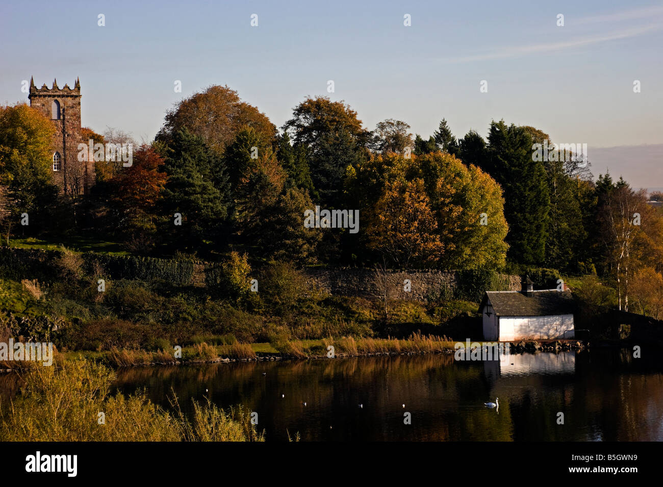Duddingston Kirk with the boatshed on the right reflected in the loch, Edinburgh, Scotland, UK, Europe Stock Photo