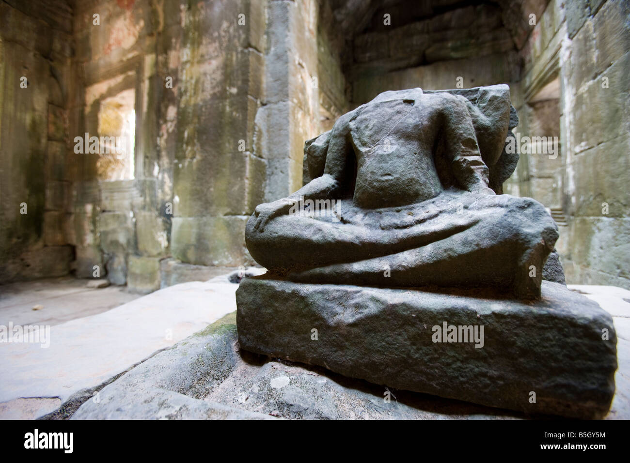 Headless statue of Buddha inside Prasat Preah Khan Temples of Angkor Siem Reap Cambodia Stock