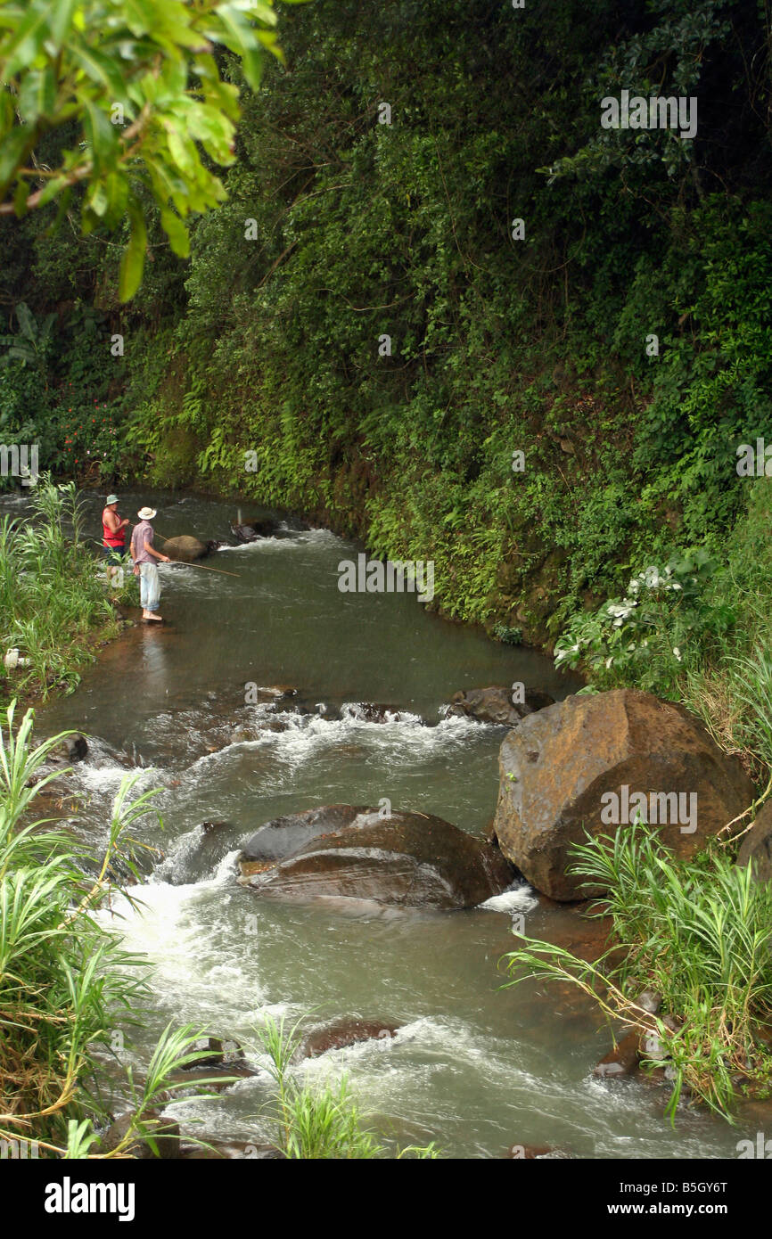 Costa Rica Local men fishing in a river Stock Photo - Alamy
