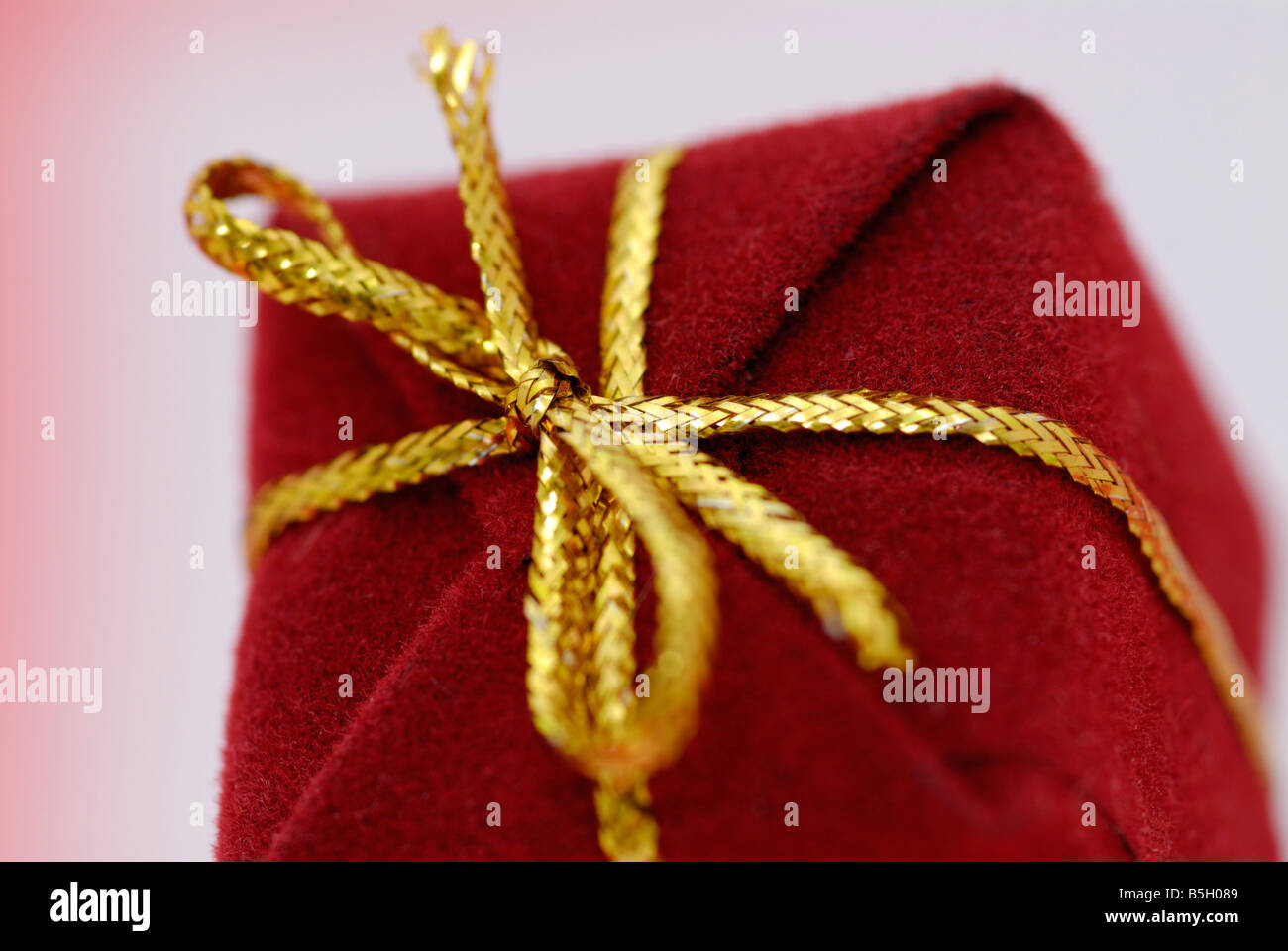 red present with a golden ribbon Stock Photo